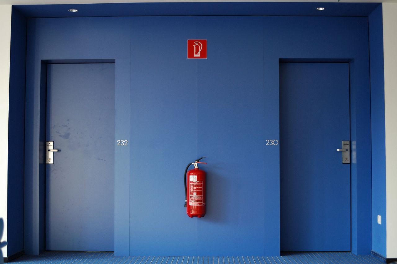 Building corridor with fire doors and a fire point