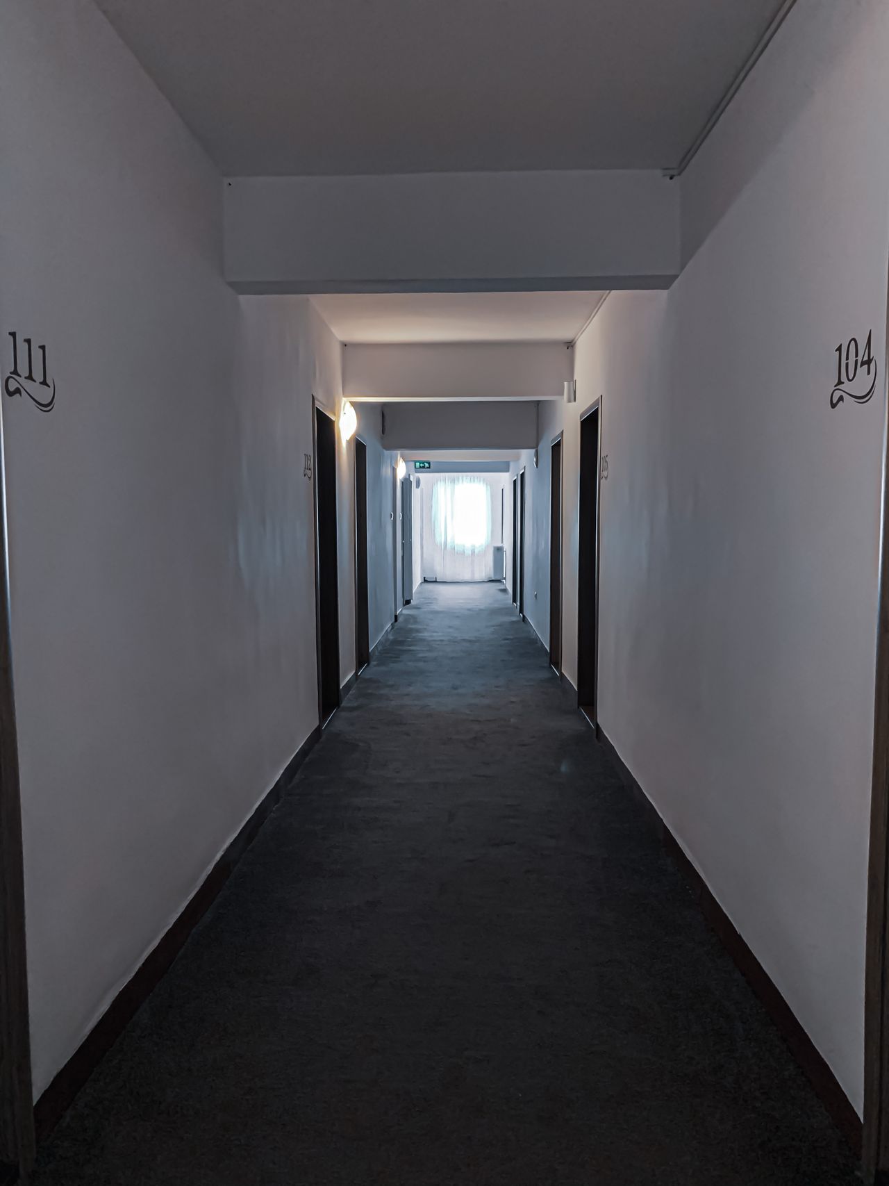 Communal residential corridor with flat entrance doors
